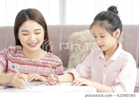 Mom and daughter at home Mom and daughter at home 62890165