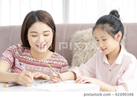 Mom and daughter at home Mom and daughter at home 62890166