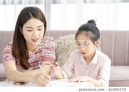 Mom and daughter at home Mom and daughter at home 62890170