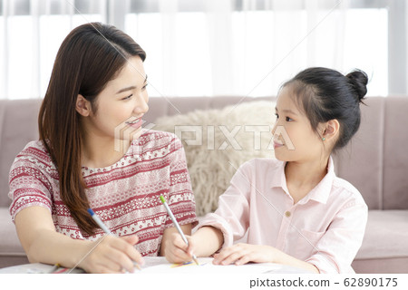 Mom and daughter at home 62890175