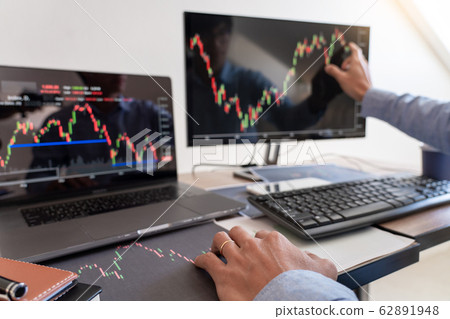 Businessman broker Analyzing finance data graphs Businessman broker Analyzing finance data graphs 62891948