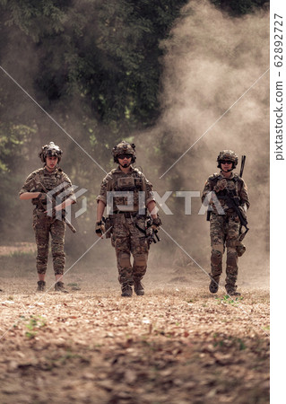 team of soldiers engaged in operation rescue team of soldiers engaged in operation rescue 62892727