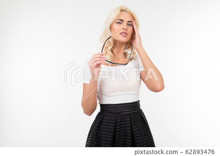Girl is having a headache and stress while wearing glasses for vision. white background and empty Girl is having a headache and stress while wearing glasses for vision. white background and empty 62893476