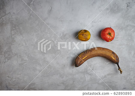 Ugly food. spoiled products lie on a gray concrete background. top view. 62893893