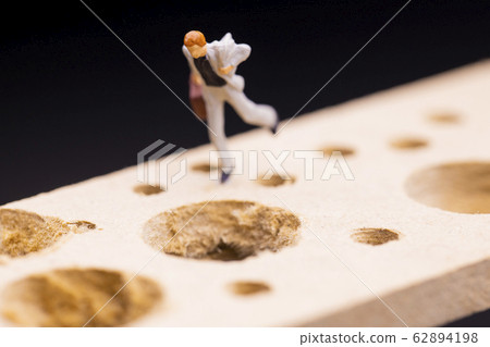 Businessman running while avoiding many pitfalls Businessman running while avoiding many pitfalls 62894198