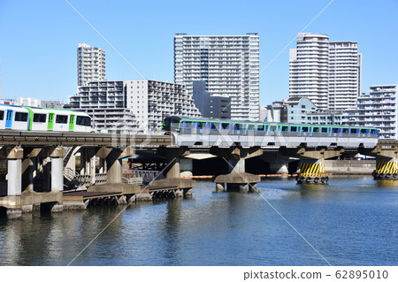 Tokyo monorail going down Keihin canal 62895010