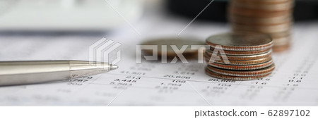 Silver pen lying over financial statistics paper with set of numbers Silver pen lying over financial statistics paper with set of numbers 62897102