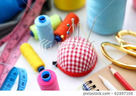 Set of threads and needles ready to be used Set of threads and needles ready to be used 62897108
