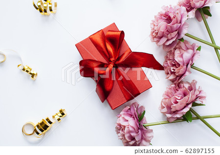 White background with red gift box and peony White background with red gift box and peony 62897155