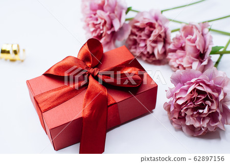 White background with red gift box and peony 62897156
