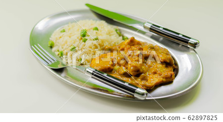 Roasted chicken breast pieces in a mildly spiced Roasted chicken breast pieces in a mildly spiced 62897825
