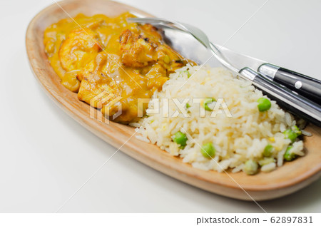 Roasted chicken breast pieces in a mildly spiced Roasted chicken breast pieces in a mildly spiced 62897831