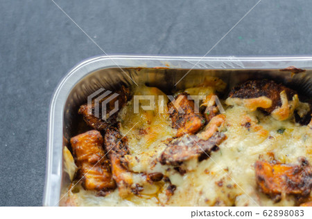 Fried potato fries coated topped with mature Fried potato fries coated topped with mature 62898083