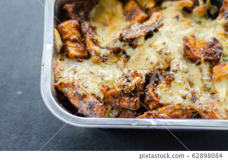 Fried potato fries coated  topped with mature 62898084