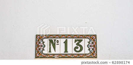 Decorative ceramic house number N13 tile on the Decorative ceramic house number N13 tile on the 62898174