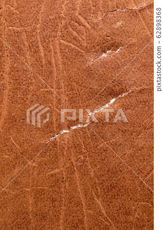 Brown leather material with cracks as background Brown leather material with cracks as background 62898368