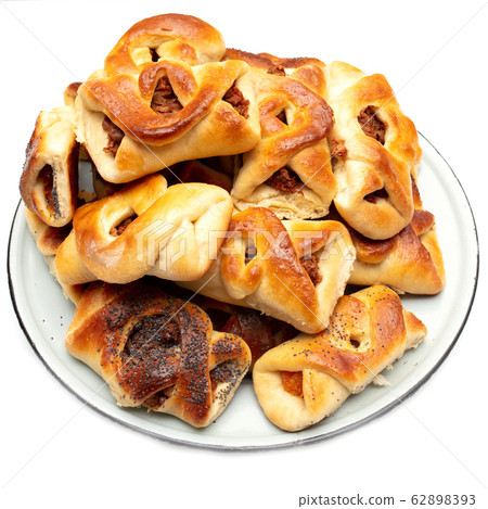 Buns with raisins and jam on a white background 62898393