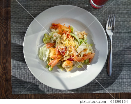 Ceasar salad with prosciutto. Top view. 62899164