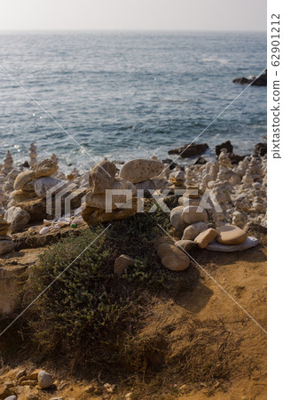 Beach with stacks of rocks called a cairns. Peniche Portugal Beach with stacks of rocks called a cairns. Peniche Portugal 62901212