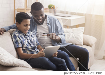 Happy Afro Father And Son With Credit Card And Digital Tablet 62901904