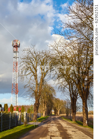 Countryside road with telecommunication tower Countryside road with telecommunication tower 62902551