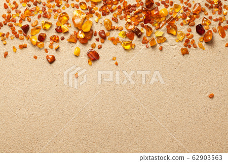 Ambers On Sand Background 62903563