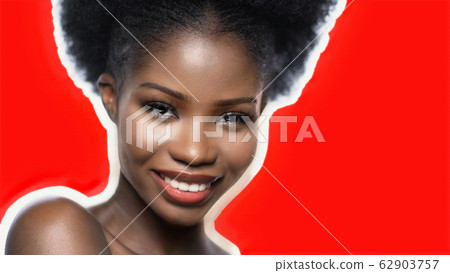 Smiling Dark-Skinned Woman With Naked Shoulders 62903757