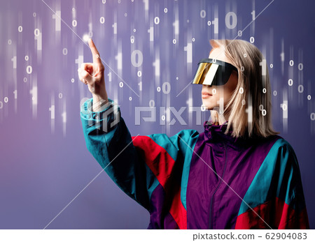 Blonde in VR glasses with binary code around 62904083
