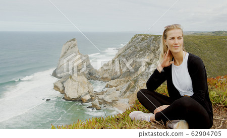 Sitting at the coast of Cabo da Roca in Portugal Sitting at the coast of Cabo da Roca in Portugal 62904705