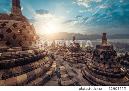 Stone stupas at Borobudur temple. Java, Indonesia Stone stupas at Borobudur temple. Java, Indonesia 62905235