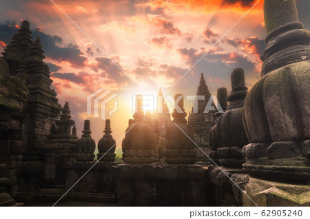 Rising sun shining at Prambanan temple. Indonesia 62905240