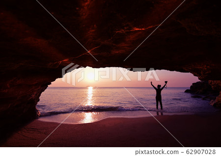 Silhouette of woman standing using camera to take Silhouette of woman standing using camera to take 62907028