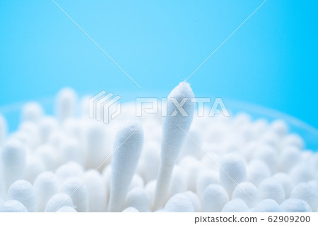 Cotton swab blue background 62909200