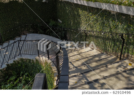 Contemporary style of stairs way down to front Contemporary style of stairs way down to front 62910496