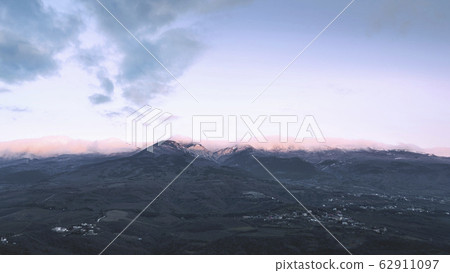 Mountains. Pink sunrise. Small towns in the valley 62911097