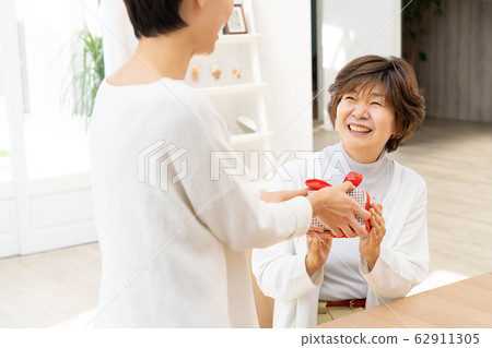 Mothers day parent and child present mother daughter family image 62911305