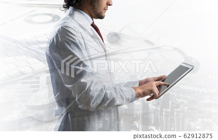 Medical industry concept by means of successful doctor Medical industry concept by means of successful doctor 62912875