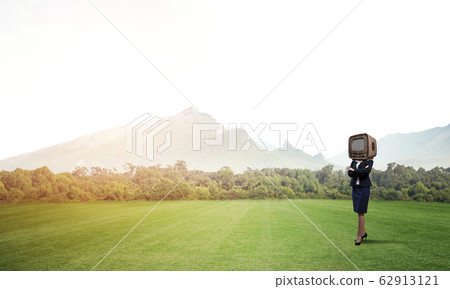 Business woman with an old TV instead of head. 62913121
