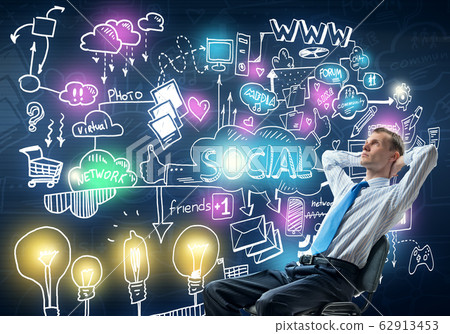 Relaxed businessman in chair Relaxed businessman in chair 62913453