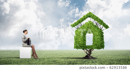 Attractive business lady or accountant outdoors on white box Attractive business lady or accountant outdoors on white box 62913586