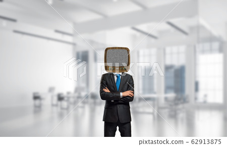 Businessman with old TV instead of head. 62913875
