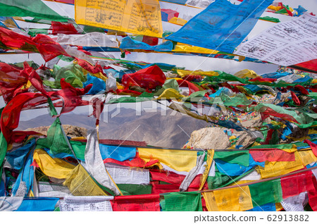 Tibetan landscape with prayer flags in foreground 62913882
