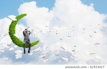 Young man in blue sky on moon dont want to hear anything Young man in blue sky on moon dont want to hear anything 62914427