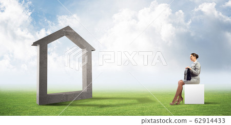 Attractive business lady or accountant outdoors on white box Attractive business lady or accountant outdoors on white box 62914433