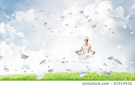Young woman keeping mind conscious. Young woman keeping mind conscious. 62914438
