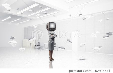 Business woman with an old TV instead of head. Business woman with an old TV instead of head. 62914541