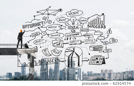 Businessman drawing business conceptual sketches. Businessman drawing business conceptual sketches. 62914574