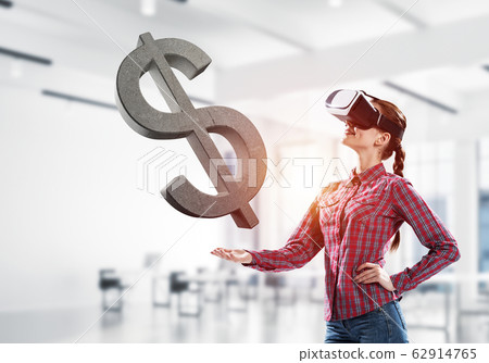 Girl in virtual reality mask experiencing virtual technology wor Girl in virtual reality mask experiencing virtual technology wor 62914765