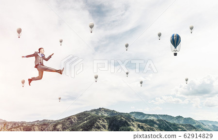 Businessman on the move. 62914829