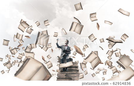 Young businessman or student studying the science and books fly Young businessman or student studying the science and books fly 62914836